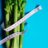 a celery stalk with a measuring band. #vegandietforweightloss